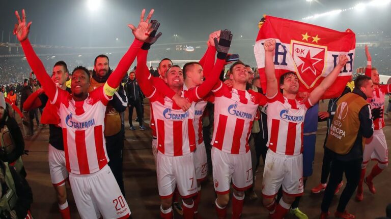 (L/R): Crvena Zvezda's Mitchell Donald, Nenad Krsticic, Marko Gobeljic and Filip Stojkovic celebrate after their victory against FC Koln in the UEFA Europa League football match between Red Star Belgrade (Crvena zvezda) and FC Koln in Belgrade on December 7, 2017. / AFP PHOTO / Pedja MILOSAVLJEVIC (Photo credit should read PEDJA MILOSAVLJEVIC/AFP/Getty Images)