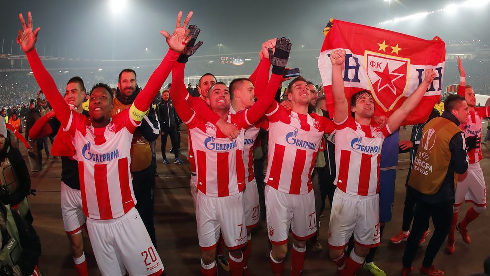 (L/R): Crvena Zvezda's Mitchell Donald, Nenad Krsticic, Marko Gobeljic and Filip Stojkovic celebrate after their victory against FC Koln in the UEFA Europa League football match between Red Star Belgrade (Crvena zvezda) and FC Koln in Belgrade on December 7, 2017. / AFP PHOTO / Pedja MILOSAVLJEVIC (Photo credit should read PEDJA MILOSAVLJEVIC/AFP/Getty Images)